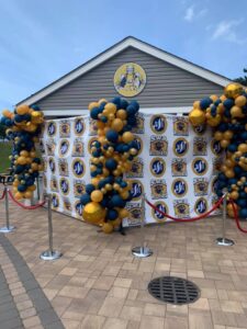 school athletic event with balloon photo backdrop