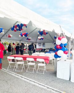 event tent decorated with patriotic balloons