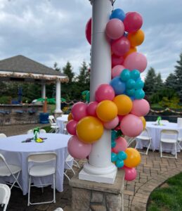 colorful balloon garland around column