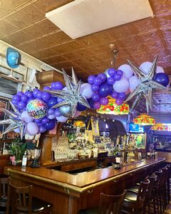 large photo garland over bar