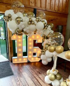 gold and white sweet 16 balloons