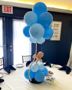 blue balloon centerpiece with rope and octopus