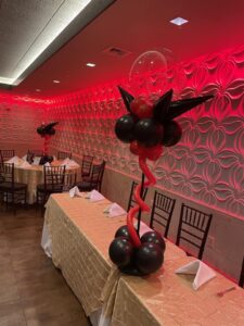 red and black balloon centerpieces