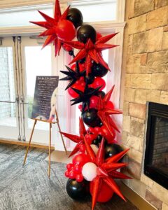 red and black balloon garland