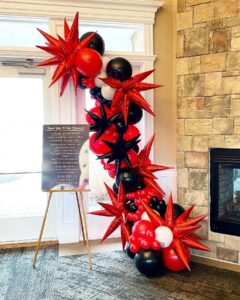 red and black balloon garland