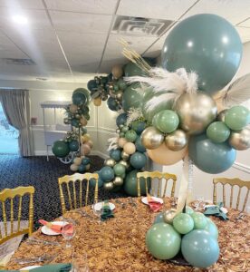 teal and silver balloon centerpiece and balloon arch
