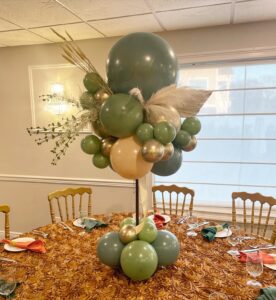teal, green, and silver balloon centerpiece