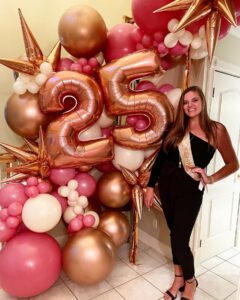 pink 25th birthday balloon arch