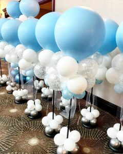 white and blue balloon centerpieces