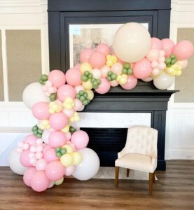 pink, white, yellow, and green balloon arch