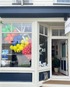 colorful balloon garland in store window