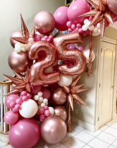 pink 25th birthday balloon arch