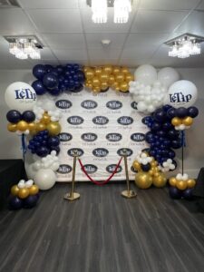 corporate event balloon arch and photo backdrop